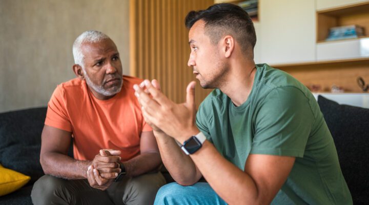 two men having a deep personal conversation - sponsorship