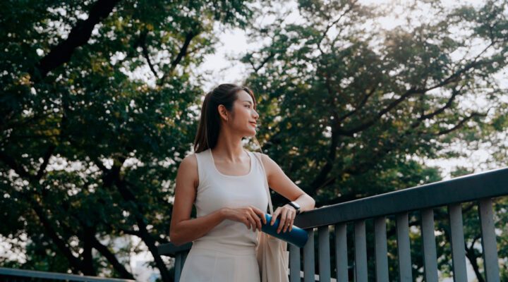 Woman on a walk in nature reflecting on life with gratitude