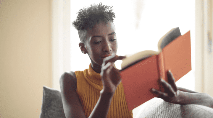 A woman reading a book.