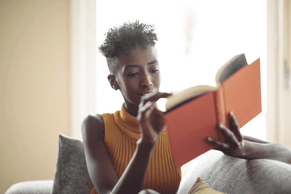 A woman reading a book.